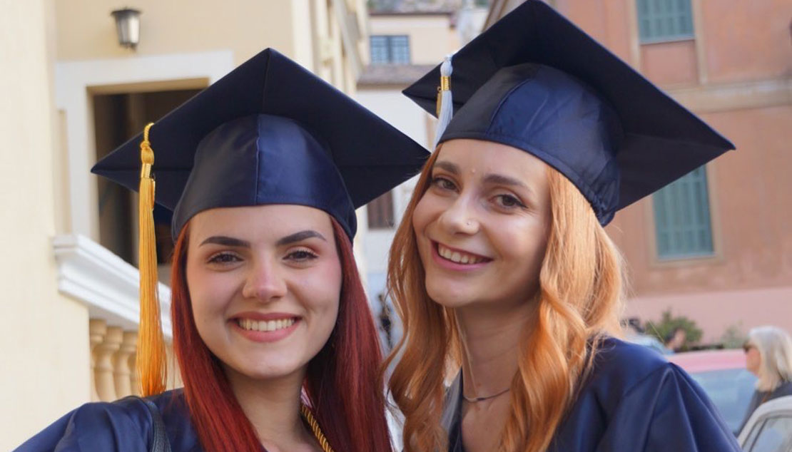 Two women graduating from Webster Athens