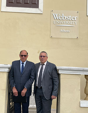 Moreno poses with Botopoulos outside of Webster University Athens for a photo.