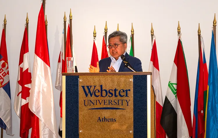 Indonesian Ambassador speaks from Webster Athens Cultural Center podium to the students