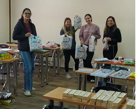 Students prepare gifts in a shopping bags