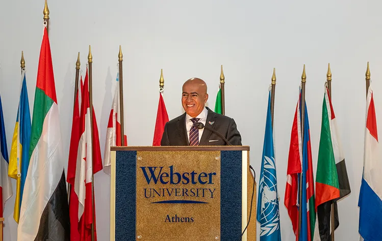 UAE Ambassador speaking to students from the podium of Webster Athens Cultural Center 